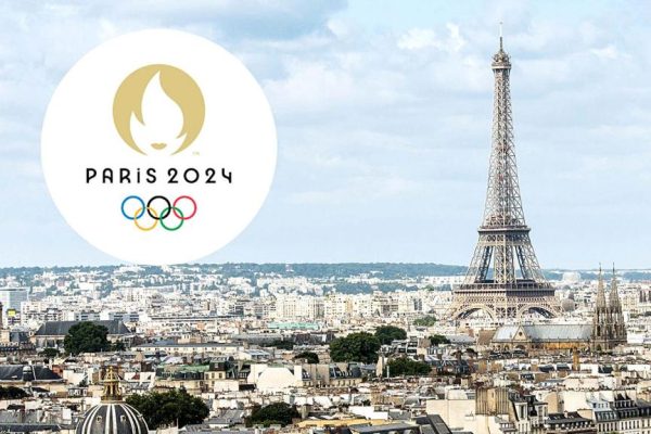 the logo of the olympic games in paris against the background of the eiffel tower