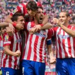 players of Atletico Madrid are happy for the victory over Valencia