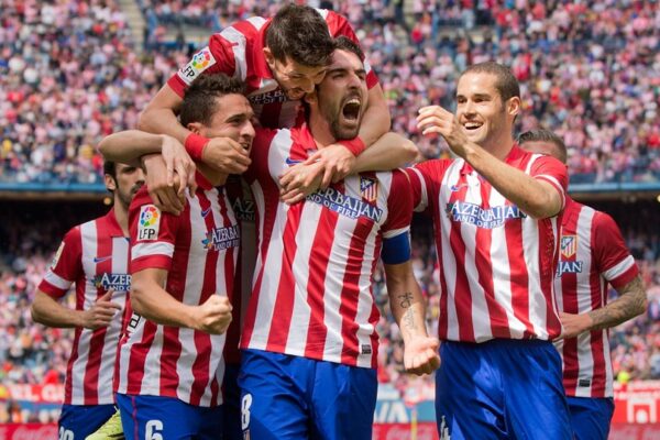 players of Atletico Madrid are happy for the victory over Valencia