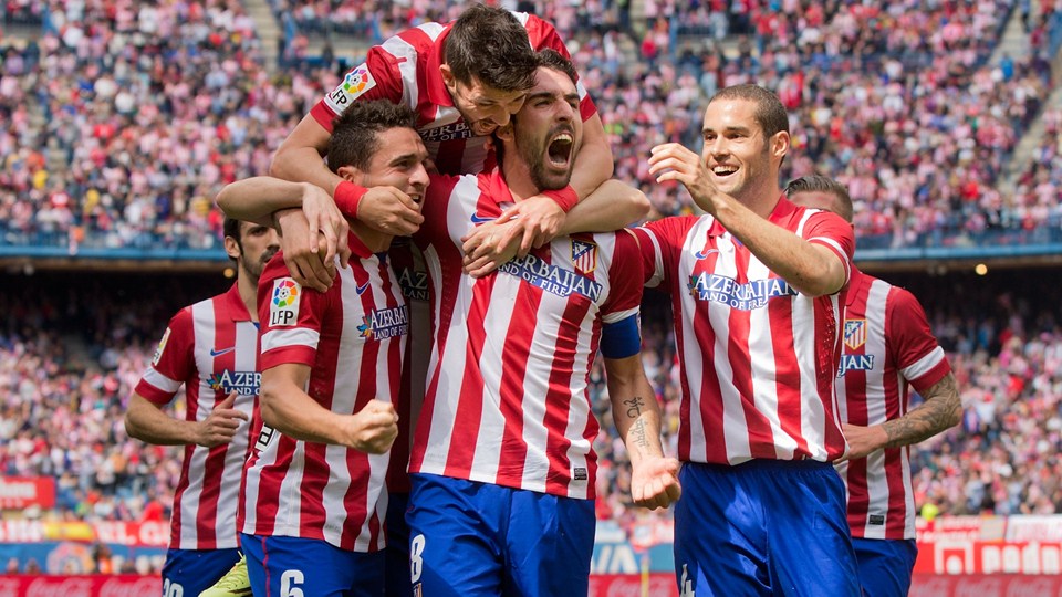 players of Atletico Madrid are happy for the victory over Valencia