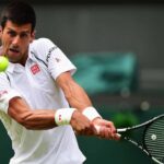 Novak Djokovic with a tennis racket before hitting the ball